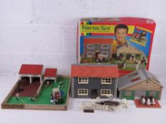 A boxed Britain's farm set having farmhouse, livestock building, Massey Ferguson MF362 tractor,