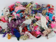 An extensive quantity of vintage Barbie and Sindy clothing, some items a/f.