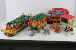 A Sylvanian Families barge with camping set, a Sylvanian Families caravan with pony,