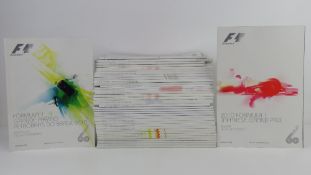 A large quantity of assorted Formula 1 race programmes for 2010.