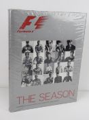 F1 The Season, 2003 edition with foreword by Bernie, portrait photography by Mikael Jansson.