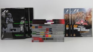 A large quantity of assorted Formula 1 race programmes for 2011 and 2012.