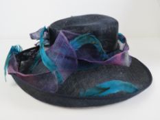 Ladies hat by Helene De Reboul in purples and blues, in box.