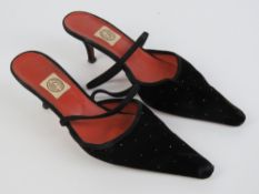 Pantalon Chameleon; a pair of ladies kitten heel slingback black velvet shoes having leather soles,