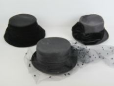 Three black ladies hats inc one with mourning vale,