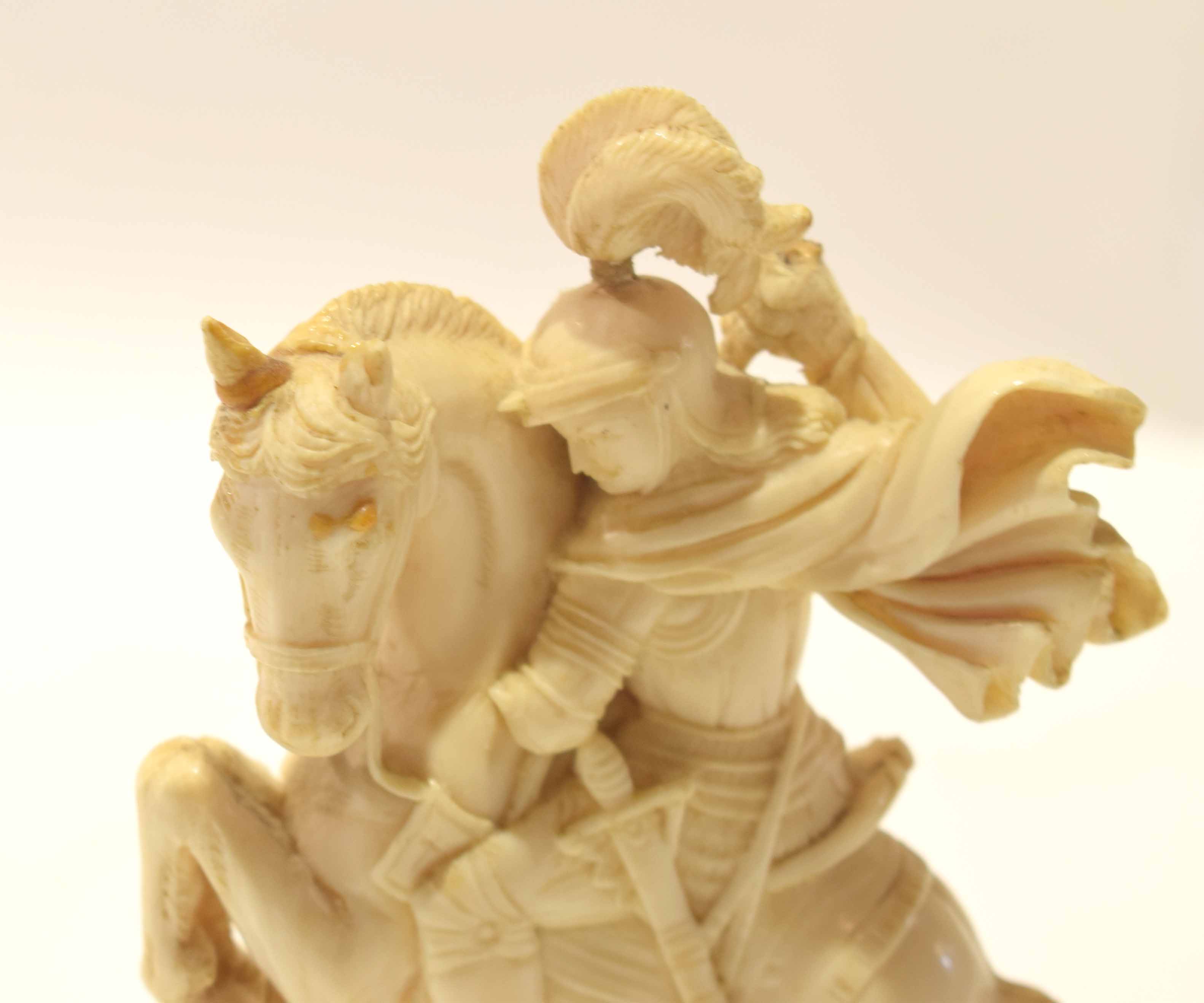 Late 19th century ivory carving of St George and the Dragon on a wooden ...