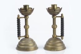 Christopher Dresser for Benham & Froud pair of brass and copper candlesticks, circa 1886, with