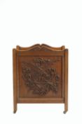 Arts and Crafts Canterbury or magazine rack, oak, with carved decoration of a dragon 52cm x 68cm x