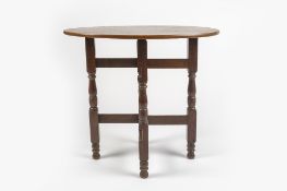 Heal & Son Ltd folding table, oak, with circular plaque to the table supports 76cm x 69cm x 61cm