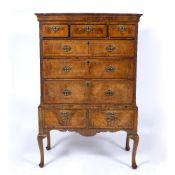Walnut chest on stand 18th Century, fitted drawers with brass drop handles, 105cm across, 54cm deep,