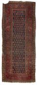 Blue ground long rug Persian, with central hook motifs within a multiple border, 297cm x 122cm