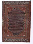 Red ground rug Caucasian, with central shape medallion, 136cm x 85cm approx Provenance: Long