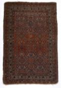 Red ground rug Caucasian, with allover foliate bird and geometric designs within a multiple