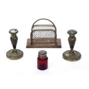 Pair of engraved brass candlesticks early 20th Century, a red glass scent bottle with silver