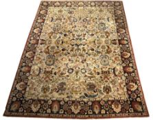 Tetex carpet with ivory ground having foliate Persian designs within a navy border, approx 337cm x