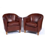 Pair of contemporary leather tub chairs on oak supports, 64cm across, 67cm high Provenance: Long