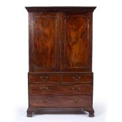 Mahogany linen press 19th Century, the upper part with panel doors fitted drawers below, 122cm