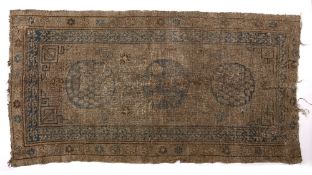 Khotan rug Chinese with three central roundels, 239cm x 122cm