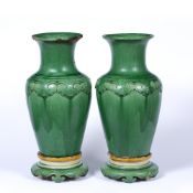 Pair of green glazed vases and stands Chinese, 18th/19th Century decorated to the neck with a ruyi