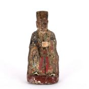 Wooden seated lohan figure Chinese, late 17th Century traces of original and later painting, 30cm