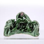 Porcelain brush rest Chinese, Qing dynasty of green glaze with birds resting in rustic lotus