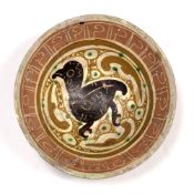 Nishapur pottery bowl Eastern Persia, 10th Century decorated in yellow and green glaze on a cream