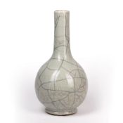 Guan type bottle vase Chinese, 19th Century covered in a pale glaze, with a fluted neck, 37.5cm