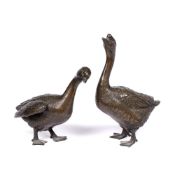 Pair of bronze model geese Japanese, Meiji period the standing birds with neck raised and craning