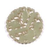White jade pierced and carved medallion form pendant Chinese, 19th Century carved as a butterfly and
