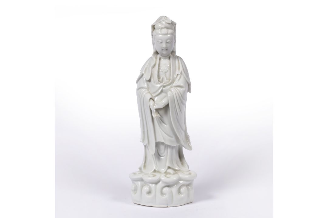 Blanc de chine standing figure of Guanyin Chinese, early 19th Century heavily potted, on a wave - Image 1 of 3