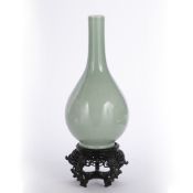 Monochrome bottle vase Chinese, 19th Century of celadon colour, the ovoid body tapering towards