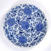 Large blue and white charger Chinese, Kangxi (1662-1722) painted with lotus flowers and trailing