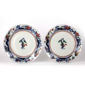 Pair of Kakiemon style large plates Japanese, Edo period each with central blossom and pine within a