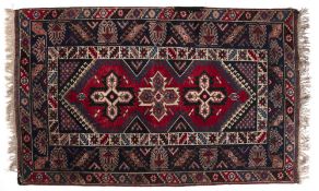 Doshmelolta rug Turkish with three central star motifs within a triple foliate and geometric border,