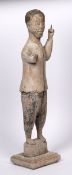 Carved wooden figure Chinese depicted standing, with one arm raised, standing on a raised plinth,
