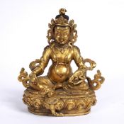 Gilt bronze figure of Amitayus Chinese, 18th Century cast seated on a lotus base, the figure holding