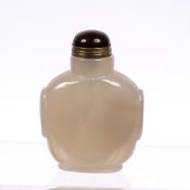 Smoky glass snuff bottle Chinese, 19th Century taotie masks to the sides and with pink stone