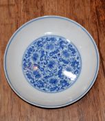 Blue and white dish Chinese decorated to the interior with a central roundel depicting floral