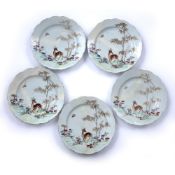 Set of five famille rose plates Chinese, 18th Century each painted with a deer beneath a palm