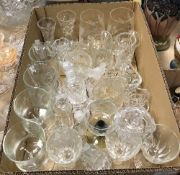 A collection of glassware to include cut glass trumpet shaped vase, a further cut glass vase,
