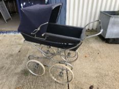 A Silver Cross pram on chrome plated supports and spoke wheels,