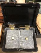 A 19th Century black lacquered and chinoiserie decorated tea caddy of shaped rectangular form,