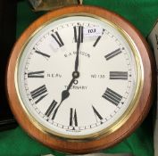 A modern pine mounted battery operated wall clock, the dial inscribed 