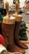 A pair of brown leather riding boots with wooden trees CONDITION REPORTS The size of