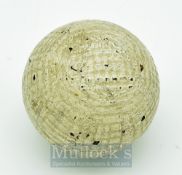 Rare Forgan Hand Hammered Guttie Golf Ball in the fine mesh style retaining 90% of white paint cover