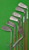 7x Various Anti-shank Smiths Patent Irons showing variations of bends from long iron to niblick,