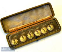 Early 20th century Cased Set of 6 Golfing Buttons: each showing golfer wearing in mid swing in