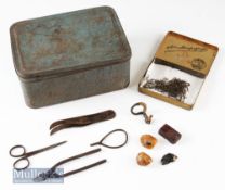 Selection of early Fly-Tying equipment including thumb vice^ tweezers plyers^ scissors and wax