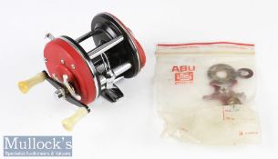 Early Abu Garcia Sweden Ambassadeur 4000 multiplier reel - red with twin white handles, foot stamp