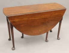 A 19th century mahogany drop leaf table. 120 cm long.